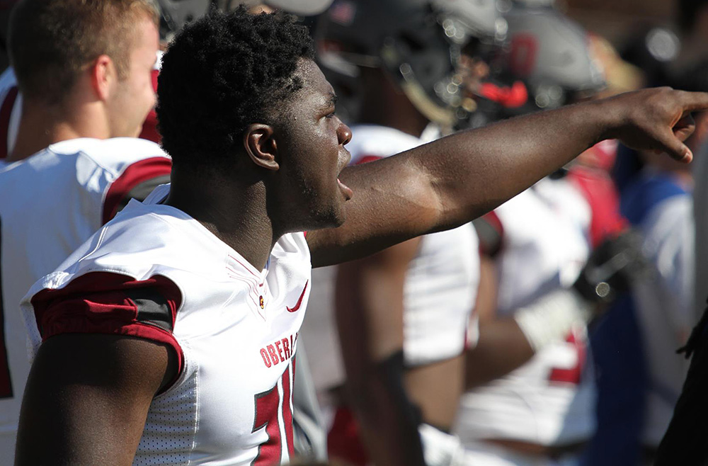 Khalid McCalla points from the sidelines. (Oberlin athletics file photo)